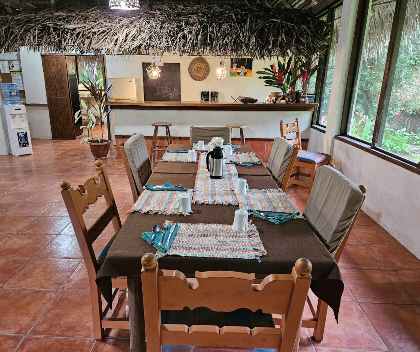 Comfortable dining chairs and tables in a jungle lodge.