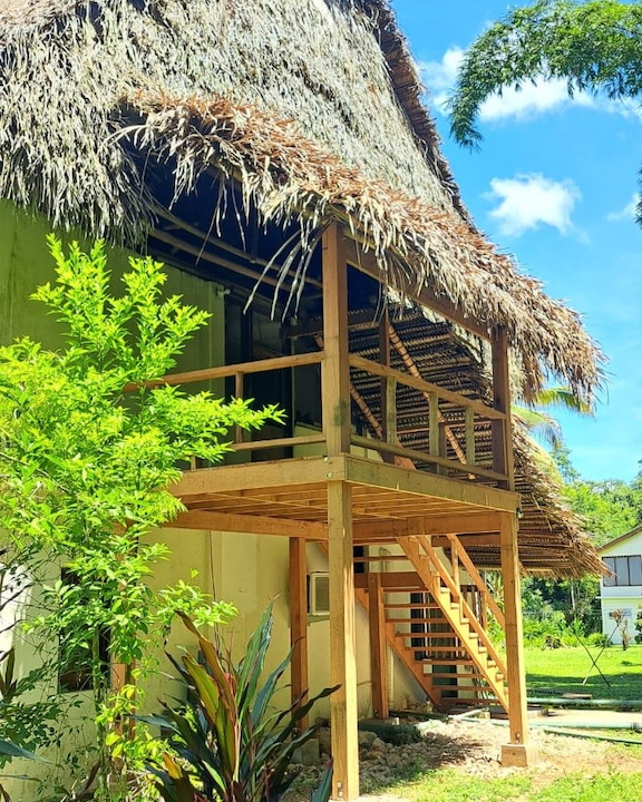A wooden porch on the rear side of the lodge.