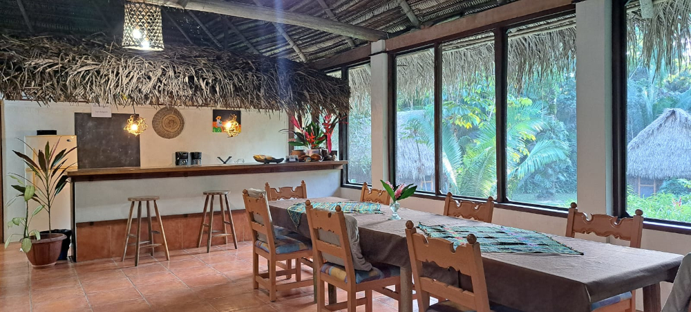 Comfortable dining chairs and tables in a jungle lodge.